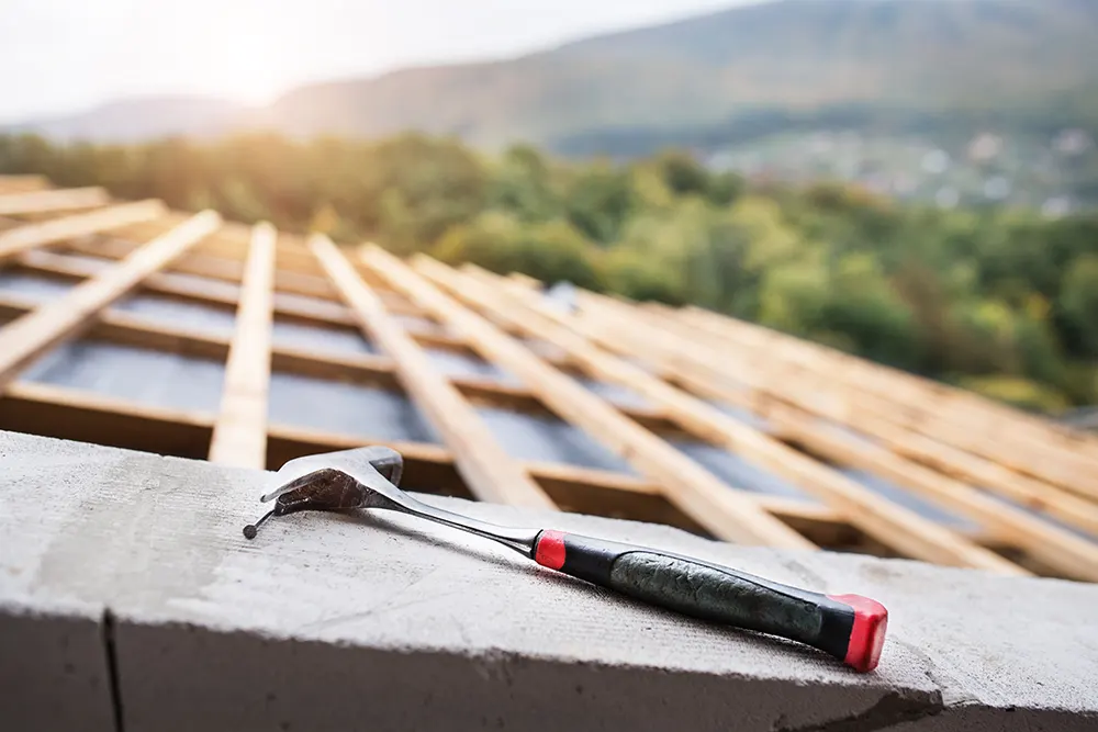 hammer on the roof on the construction site 2023 11 27 05 37 26 utc